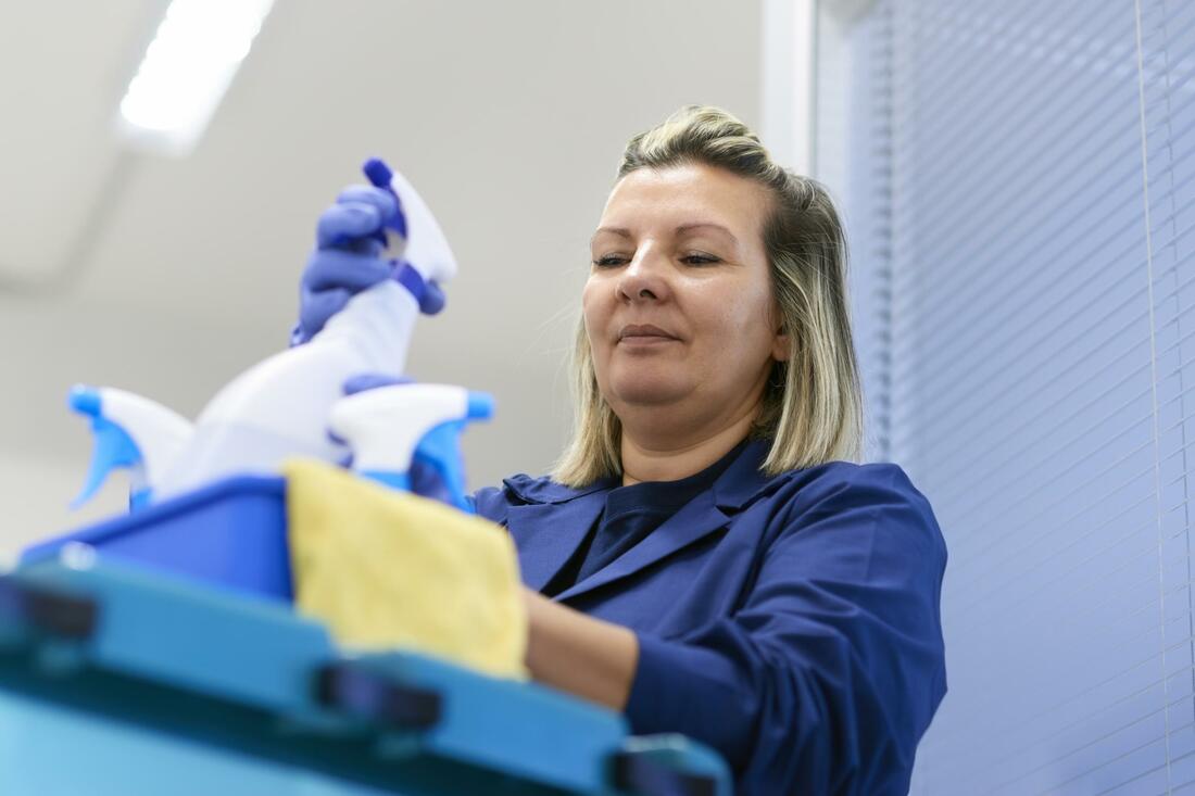 a cleaning woman with supplies